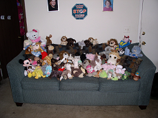 A bunch of stuffed animals on a couch