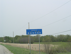 Roadside sign entering Kansas
