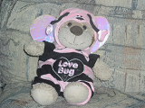A stuffed lion in a Love Bug costume