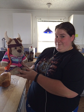 A girl holding a stuffed lion